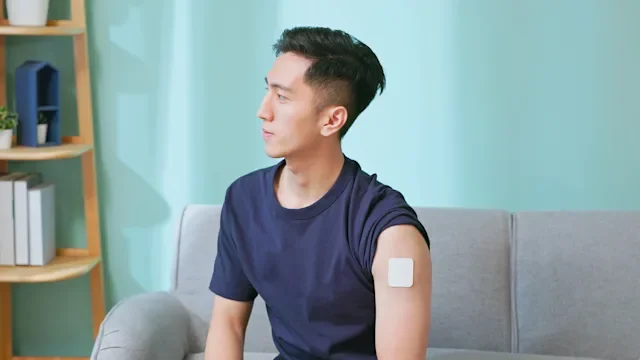 Smoking cessation: man wearing nicotine patch 2186636522